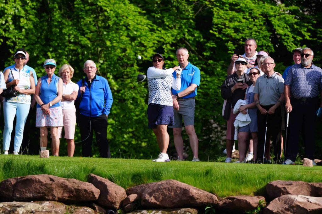 People playing golf on a sunny day
